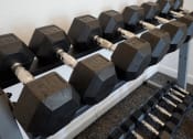 Thumbnail 21 of 39 - weights at shoreline landing's on-site fitness center