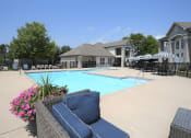 Thumbnail 27 of 39 - Lounge and pool area at apartment in Norton Shores, MI