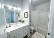 Thumbnail 14 of 39 - full bathroom with tub and large vanity space