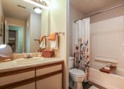 Thumbnail 5 of 10 - a bathroom with a sink toilet and shower