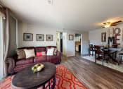 Thumbnail 1 of 10 - apartment living room with a couch and a table