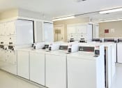 Thumbnail 5 of 13 - apartment complex with laundry facility