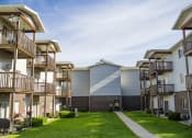 Thumbnail 6 of 10 - an exterior view of an apartment complex