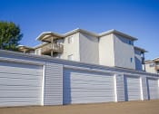 Thumbnail 7 of 10 - apartment complex with a garages