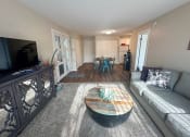 Thumbnail 2 of 20 - a living room with a couch and a table