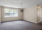 Thumbnail 7 of 20 - an empty bedroom with a large window