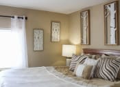 Thumbnail 9 of 31 - a bedroom with a large bed and big mirrors