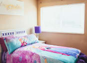 Thumbnail 12 of 31 - a bedroom with a bed and a window