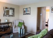 Thumbnail 3 of 31 - a living room with a couch and a chair