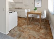 Thumbnail 3 of 8 - a kitchen with a table and chairs and a stove