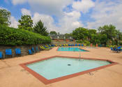 Thumbnail 9 of 17 - a swimming pool with chairs around it