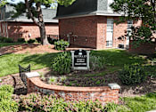 Thumbnail 28 of 33 - A sign in front of a brick building reads "Breakfast.".