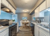 Thumbnail 5 of 26 - Galley Style Kitchen at Summit on the Lake with Lots of Storage