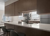 Thumbnail 5 of 33 - a kitchen with a large counter top and a sink
