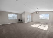 Thumbnail 2 of 33 - an empty living room with a door to a patio