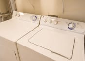 Thumbnail 17 of 33 - a washer and dryer in the laundry room of a home