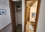 Thumbnail 18 of 28 - A bathroom with a toilet and a rug on the floor.
