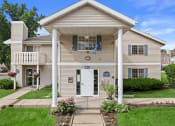 Thumbnail 26 of 28 - the front of a sun valley apartments with pillars and balconies