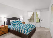 Thumbnail 13 of 29 - a bedroom with a bed and a window