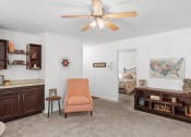 Thumbnail 6 of 29 - a living room with a ceiling fan    and a bedroom