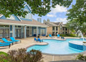 Thumbnail 23 of 29 - our apartments offer a large pool and patio with chairs