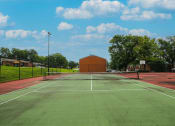 Thumbnail 3 of 10 - a tennis court at apartment complex