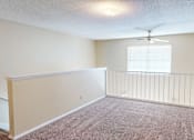 Thumbnail 11 of 30 - A room with a ceiling fan and a window with blinds.