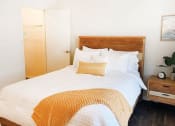 Thumbnail 2 of 16 - a bedroom with a bed and a pillow on it