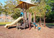Thumbnail 15 of 16 - a playground with a slide and other playground equipment