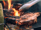 Thumbnail 10 of 12 - a steak being grilled on a grill