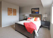 Thumbnail 3 of 12 - a bedroom with a bed and two nightstands