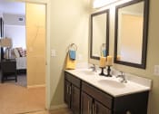 Thumbnail 5 of 12 - a bathroom with two sinks and two mirrors