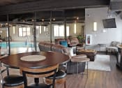Thumbnail 8 of 12 - a large living room with a pool in the background