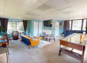 Thumbnail 5 of 10 - a living room filled with furniture and a pool table
