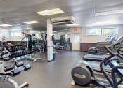 Thumbnail 8 of 10 - a gym with weights and other exercise equipment