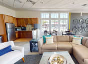 Thumbnail 2 of 10 - a living room with a couch and a table