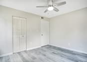 Thumbnail 8 of 29 - Bedroom with overhead fan and wood style flooring