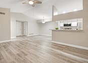 Thumbnail 1 of 29 - Living and dining area with wood flooring and granite counters