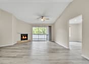 Thumbnail 9 of 29 - spacious living area with attached patio and fire place