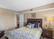 Thumbnail 9 of 31 - a bedroom with a yellow and blue bed