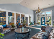 Thumbnail 15 of 31 - a living room with couches and a table