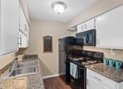 Thumbnail 6 of 31 - apartment kitchen with a microwave and Energy-Efficient Appliances
