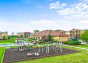Thumbnail 28 of 31 - playground and a pool at apartment complex
