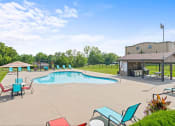 Thumbnail 27 of 31 - a swimming pool with grill station