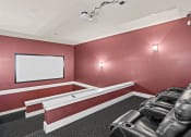 Thumbnail 20 of 31 - a theater room with leather chairs and a white screen