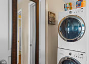 Thumbnail 13 of 31 - a washer and dryer in apartment