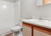 Thumbnail 12 of 23 - bathroom with a sink, toilet and tub