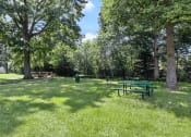 Thumbnail 18 of 23 - picnic table in a courtyard by an apartment building