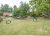 Thumbnail 27 of 28 - Dog park at Woods of Post House Apartments in Jackson, TN