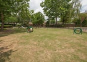 Thumbnail 28 of 28 - Dog park at Woods of Post House Apartments in Jackson, TN